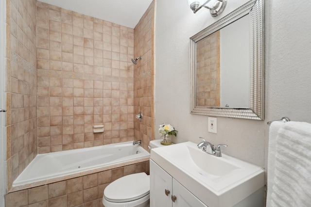 full bathroom with tiled shower / bath, vanity, and toilet