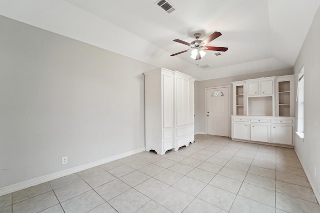 unfurnished bedroom with light tile patterned floors and ceiling fan