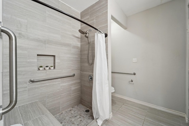 bathroom with tile patterned flooring and a shower with shower curtain