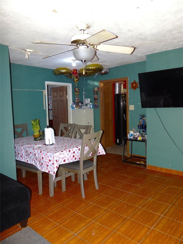 dining room featuring a textured ceiling