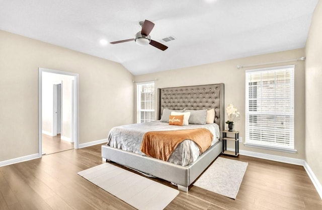 bedroom with wood-type flooring, vaulted ceiling, and ceiling fan