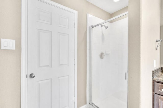 bathroom with vanity and walk in shower