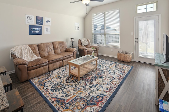 living room featuring lofted ceiling, plenty of natural light, dark hardwood / wood-style floors, and ceiling fan