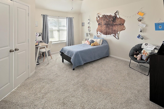 bedroom with light colored carpet and a closet