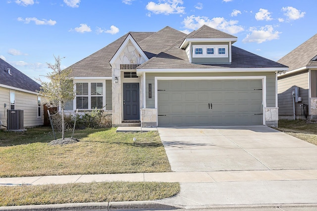 view of front of home featuring a front lawn and central air condition unit