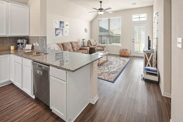 kitchen featuring white cabinetry, stainless steel dishwasher, kitchen peninsula, and sink