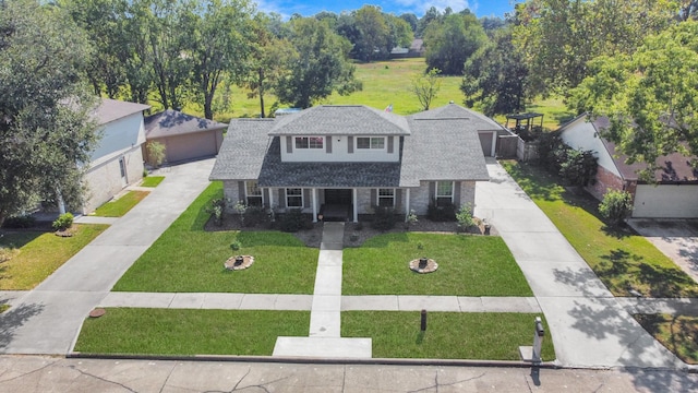 view of front of house with a front yard and a fire pit