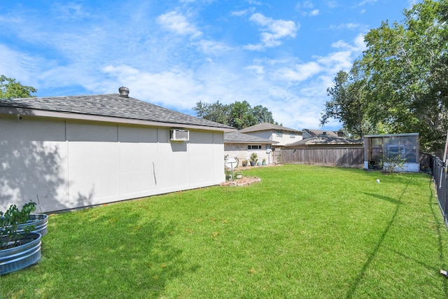 view of yard featuring a wall mounted air conditioner