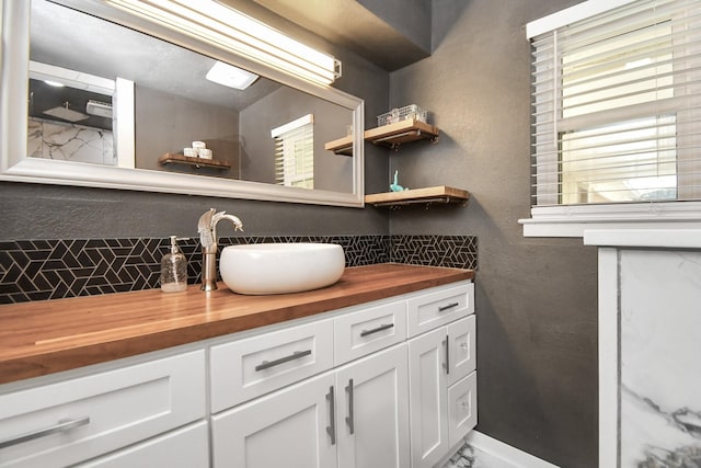 bathroom with vanity and a wealth of natural light