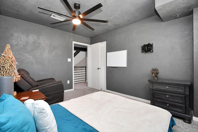 bedroom featuring light carpet and ceiling fan