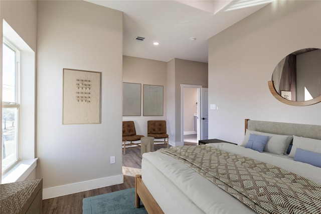 bedroom with recessed lighting, visible vents, dark wood finished floors, and baseboards