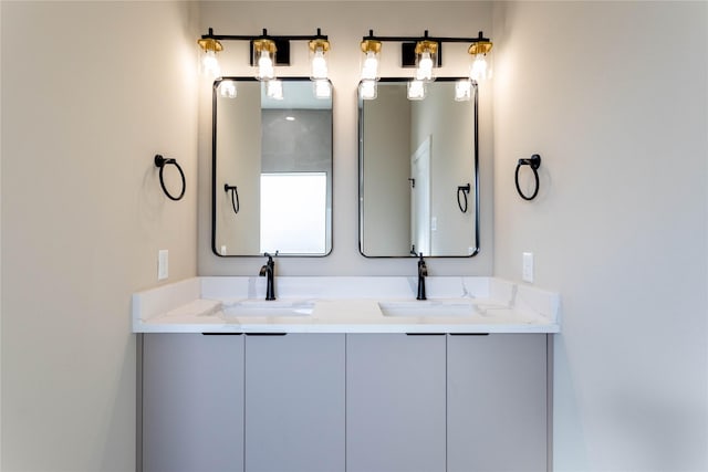 full bath with double vanity and a sink