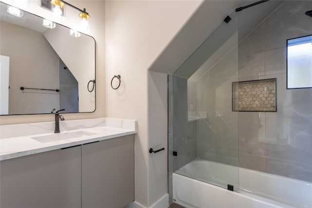 full bathroom with enclosed tub / shower combo and vanity