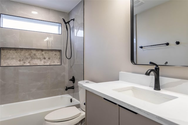 bathroom featuring tub / shower combination, vanity, and toilet