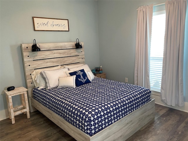 bedroom featuring dark hardwood / wood-style floors