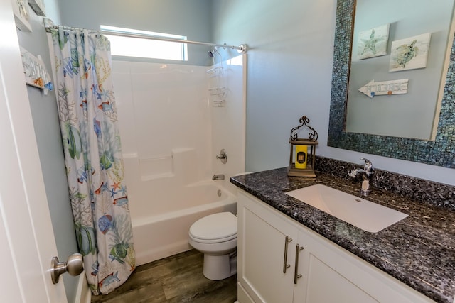 full bathroom with toilet, vanity, shower / bathtub combination with curtain, and hardwood / wood-style flooring