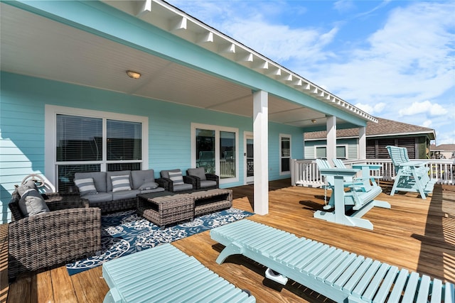 wooden terrace featuring outdoor lounge area