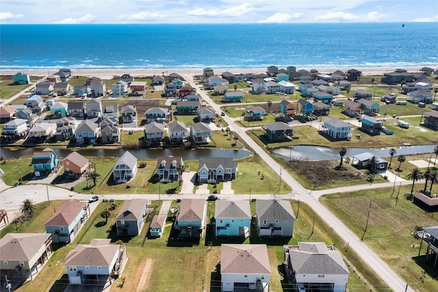 drone / aerial view with a residential view and a water view