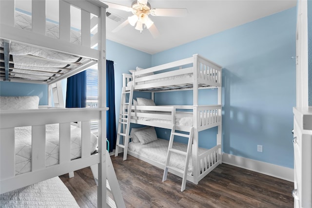 bedroom featuring ceiling fan, baseboards, wood finished floors, and visible vents