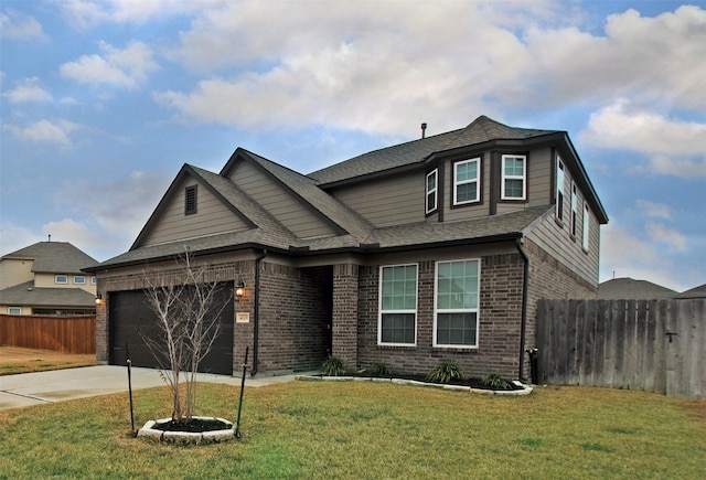 view of front of house featuring a garage and a front yard