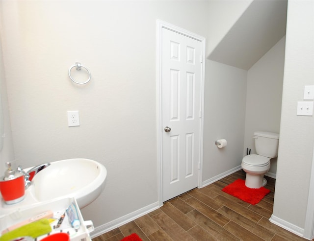 bathroom featuring sink and toilet