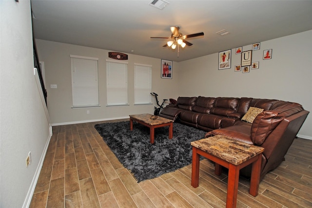 living room with hardwood / wood-style floors and ceiling fan