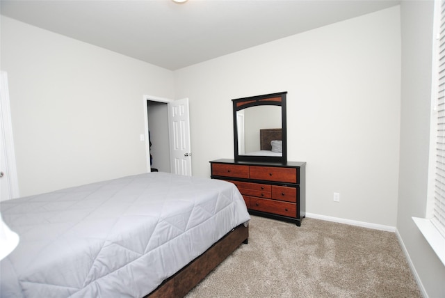 bedroom with light carpet