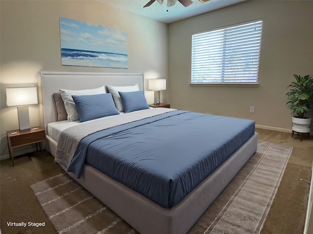 carpeted bedroom with ceiling fan