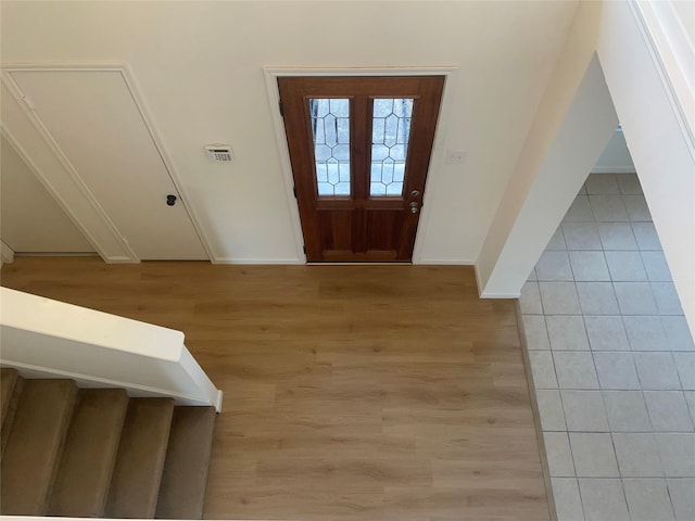 foyer entrance with light wood-type flooring