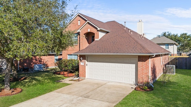 view of front property featuring a garage and a front lawn