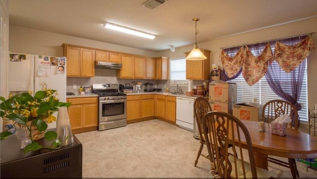 kitchen featuring light brown cabinetry, gas stove, white dishwasher, pendant lighting, and decorative backsplash