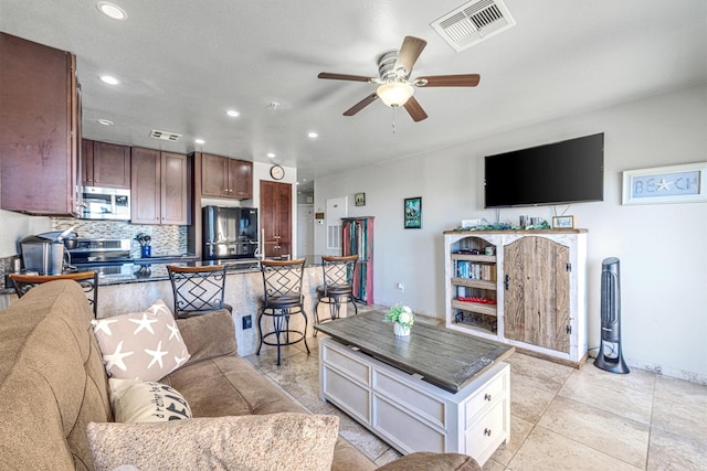 9520 Seawall Blvd Unit 354, Galveston, TX 77554 - living room featuring ceiling fan, recessed lighting, and baseboards