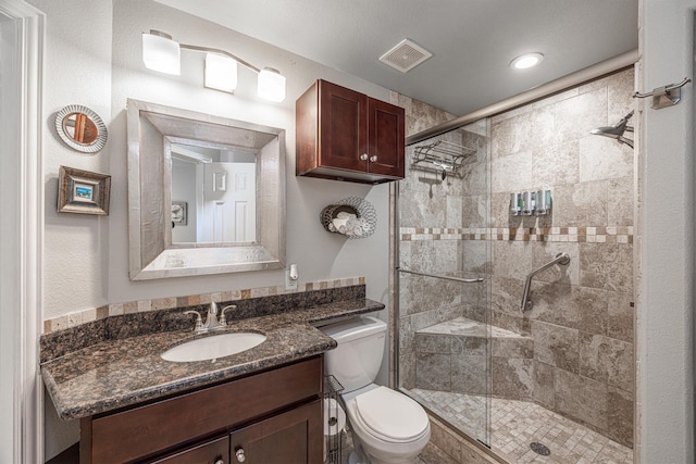 9520 Seawall Blvd Unit 354, Galveston, TX 77554 - full bathroom featuring a shower stall, toilet, vanity, and recessed lighting