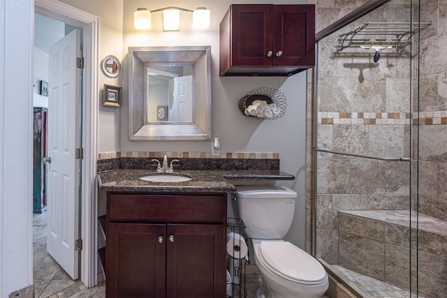 9520 Seawall Blvd Unit 354, Galveston, TX 77554 - bathroom featuring a shower stall, toilet, and vanity