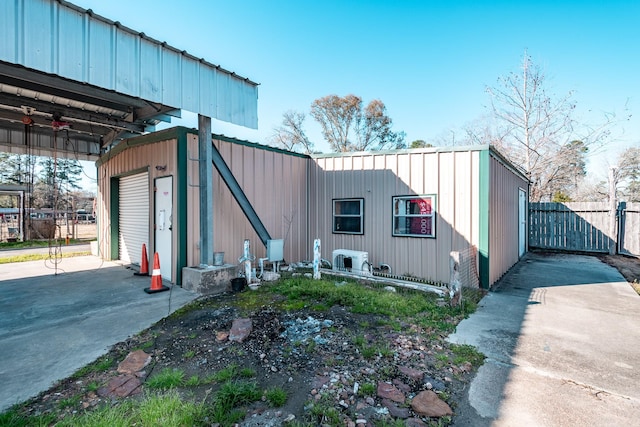 view of home's exterior with a garage and an outdoor structure