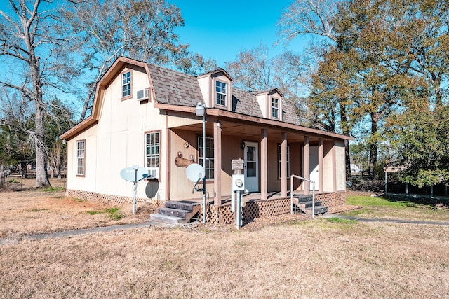 view of front of property with a porch and a front yard