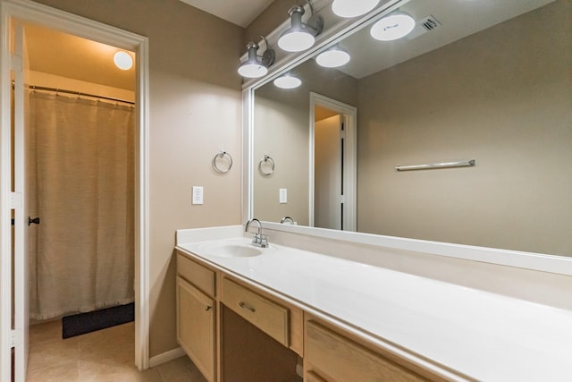 bathroom with vanity, tile patterned floors, and walk in shower