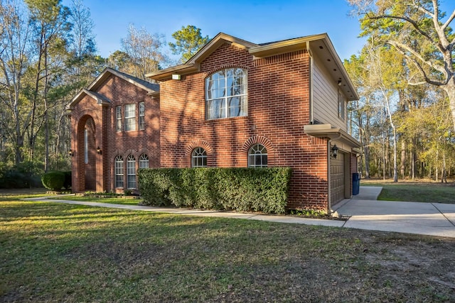 view of front facade with a garage and a front yard