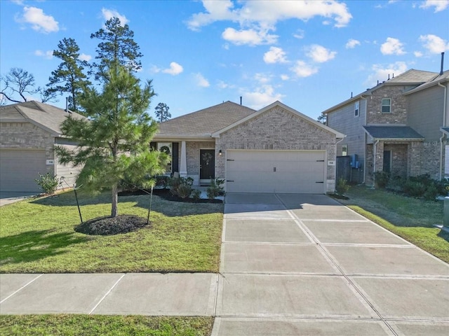 view of front of property featuring a garage and a front lawn