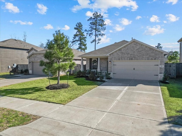 single story home featuring a garage and a front lawn