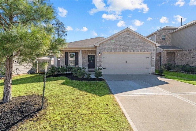 view of front of house with a garage and a front lawn