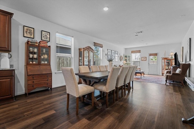 dining room with dark hardwood / wood-style floors