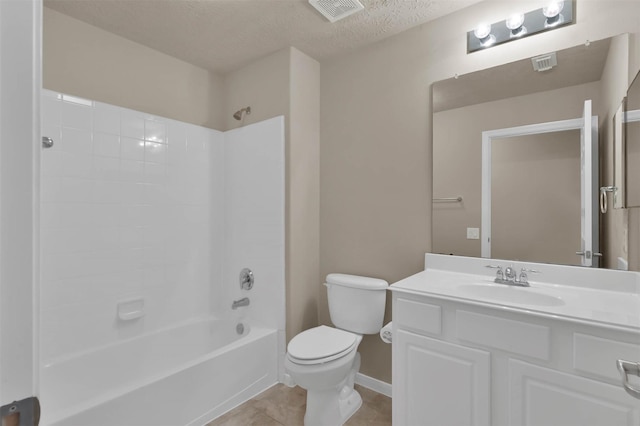 full bathroom with tile patterned floors, toilet, a textured ceiling, shower / bathtub combination, and vanity