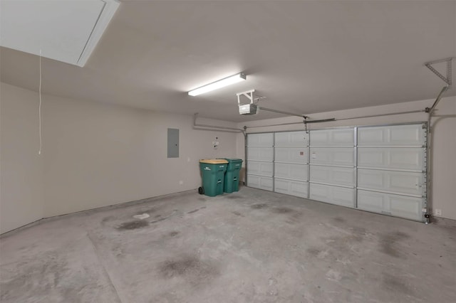 garage with a garage door opener and electric panel