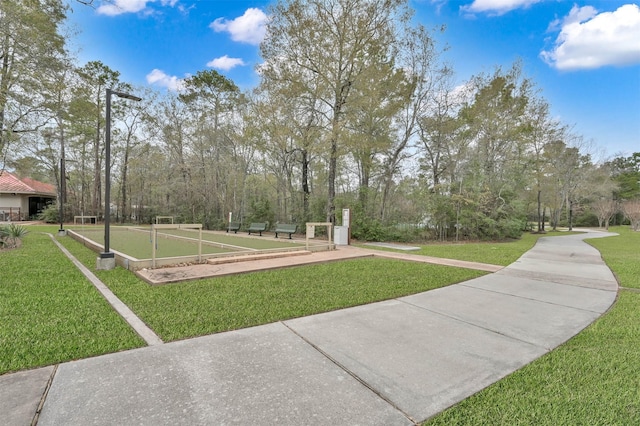 view of community featuring a lawn