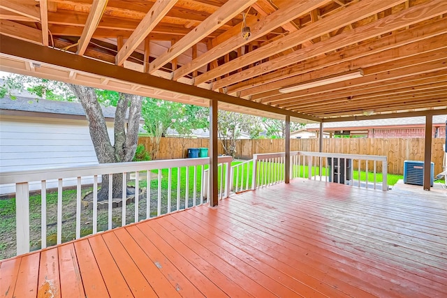 wooden deck featuring cooling unit and a yard