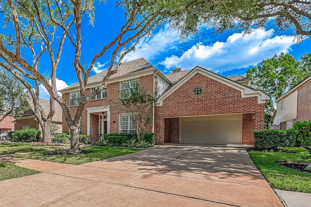 view of front of house featuring a garage and a front yard