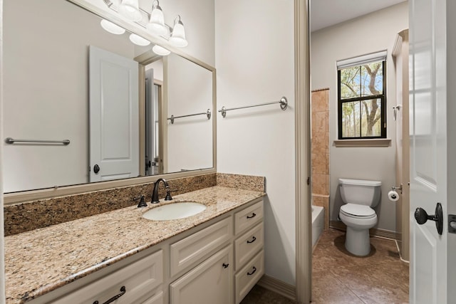 bathroom with vanity, tile patterned flooring, and toilet