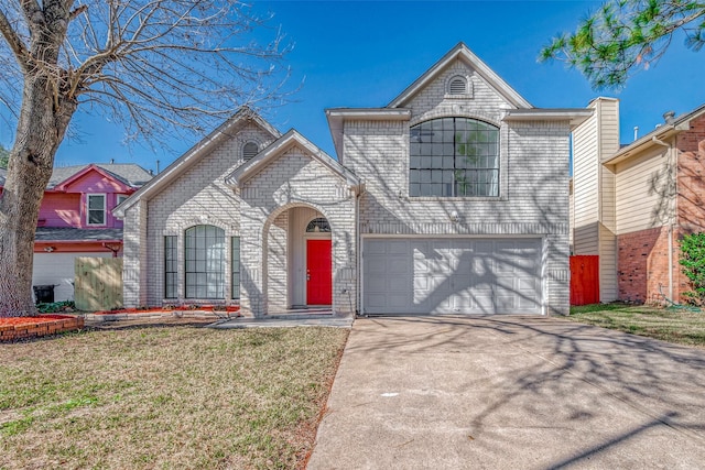 view of front of home featuring a garage and a front yard