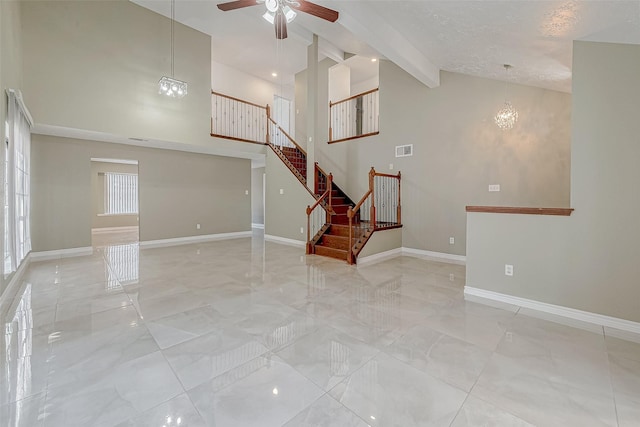 unfurnished room featuring ceiling fan with notable chandelier, high vaulted ceiling, and beamed ceiling